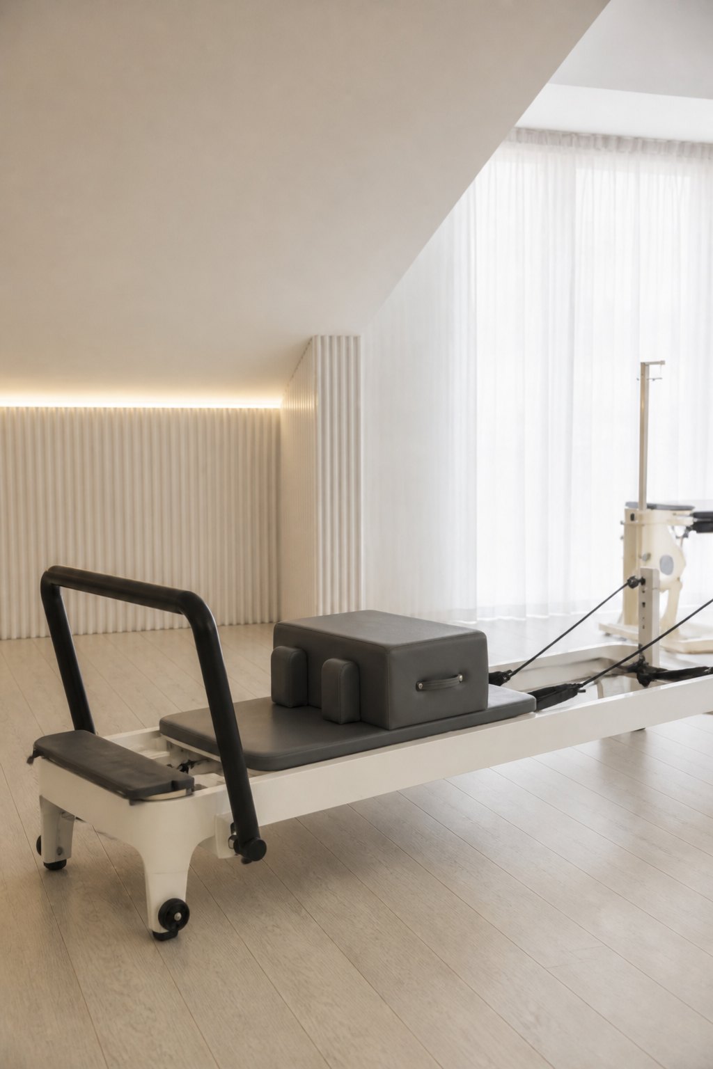 Reformer Pilates equipment in a calm movement space
